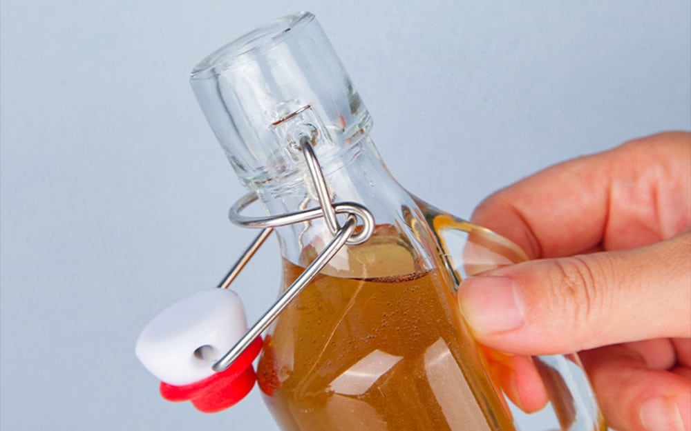 swing top cap for glass juice bottle